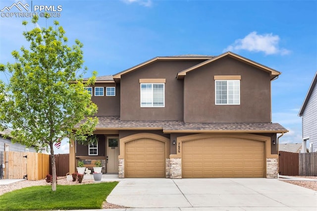 7656 Peachleaf Dr, Colorado Springs, CO 80925 - view of front facade featuring stone siding, driveway, an attached garage, and stucco siding