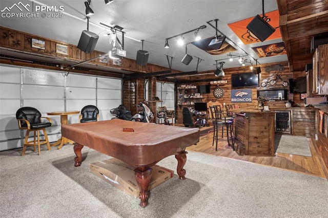7656 Peachleaf Dr, Colorado Springs, CO 80925 - game room with pool table, a garage, wine cooler, wooden walls, and wood finished floors