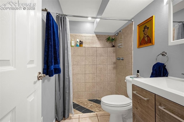 2115 Rangeview Dr, Pueblo, CO 81008 - bathroom with vanity, toilet, a tile shower, and tile patterned flooring