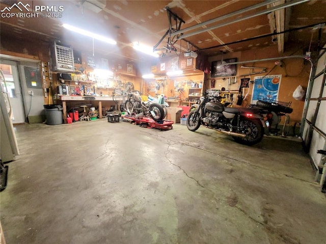 2115 Rangeview Dr, Pueblo, CO 81008 - garage featuring a workshop area and a garage door opener