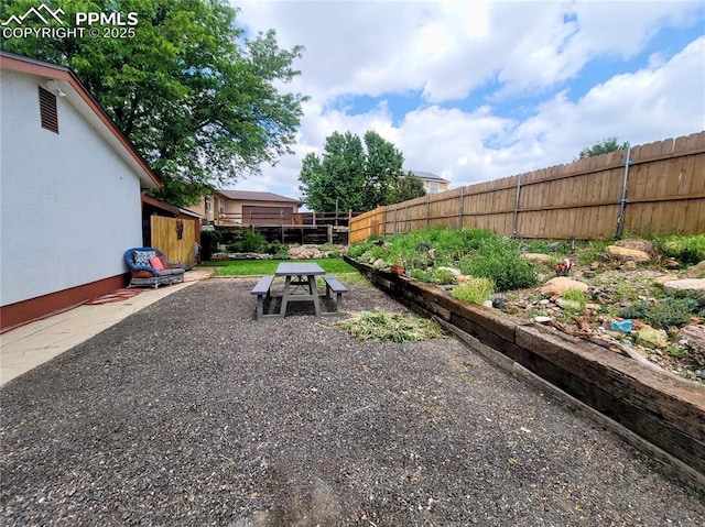 2115 Rangeview Dr, Pueblo, CO 81008 - fenced backyard with a patio area