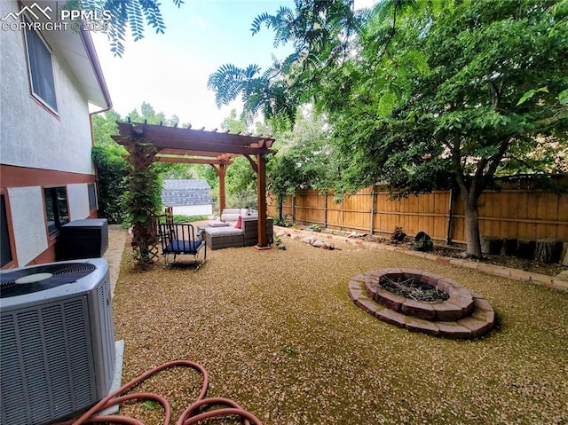 2115 Rangeview Dr, Pueblo, CO 81008 - fenced backyard featuring cooling unit, a pergola, a patio, and an outdoor living space with a fire pit