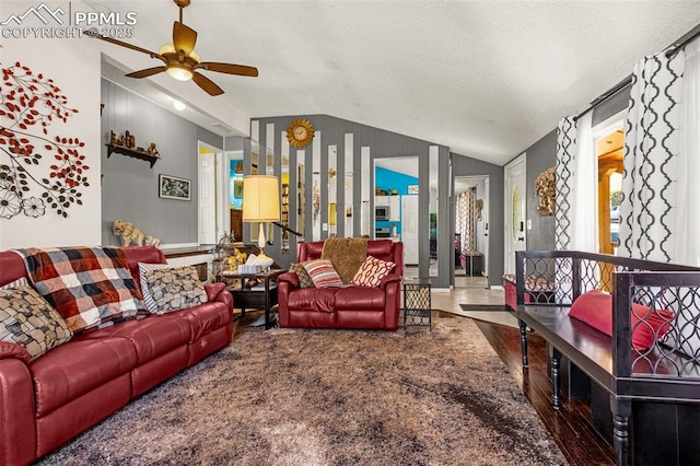 2115 Rangeview Dr, Pueblo, CO 81008 - living area featuring lofted ceiling, a ceiling fan, wood finished floors, and a textured ceiling