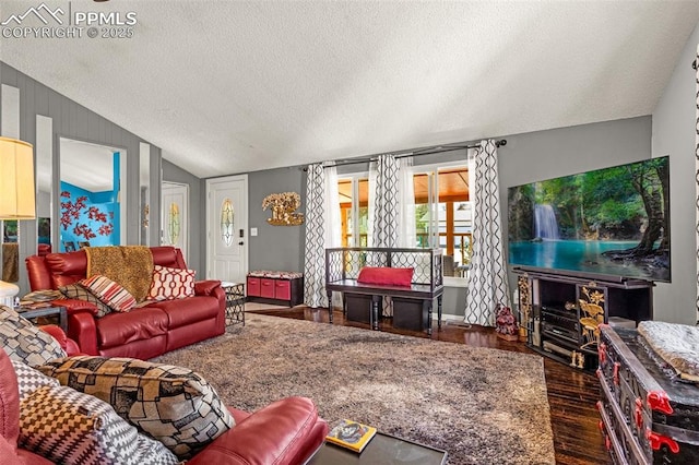 2115 Rangeview Dr, Pueblo, CO 81008 - living area with a textured ceiling, vaulted ceiling, and wood finished floors