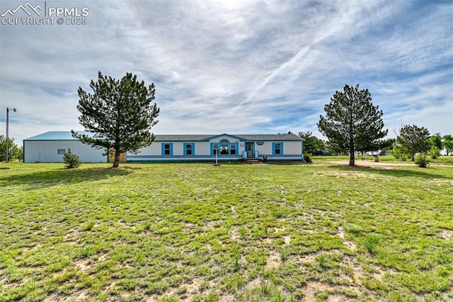 20040 Drennan Rd, Colorado Springs, CO 80928 - ranch-style house with a front lawn