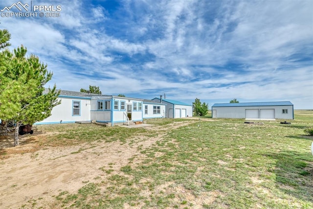 20040 Drennan Rd, Colorado Springs, CO 80928 - back of house featuring an outdoor structure and a yard