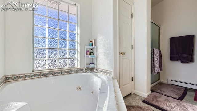971 S Los Charros Dr, Pueblo West, CO 81007 - full bath with a baseboard heating unit, a jetted tub, a closet, and a shower with door