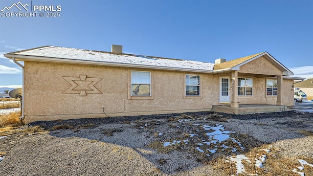 971 S Los Charros Dr, Pueblo West, CO 81007 - rear view of property with a patio area, stucco siding, and a chimney