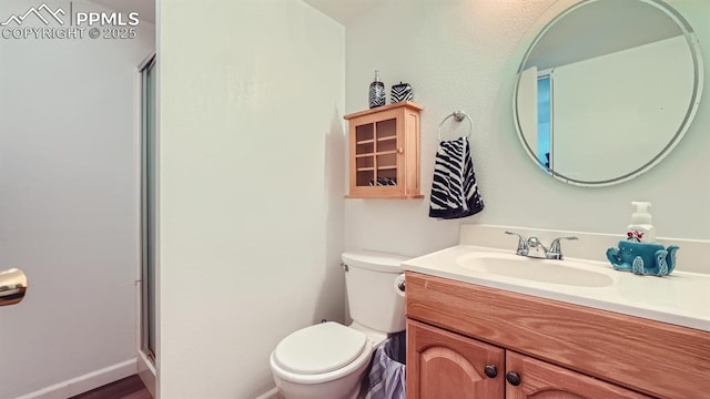 971 S Los Charros Dr, Pueblo West, CO 81007 - bathroom with vanity, toilet, and a shower stall