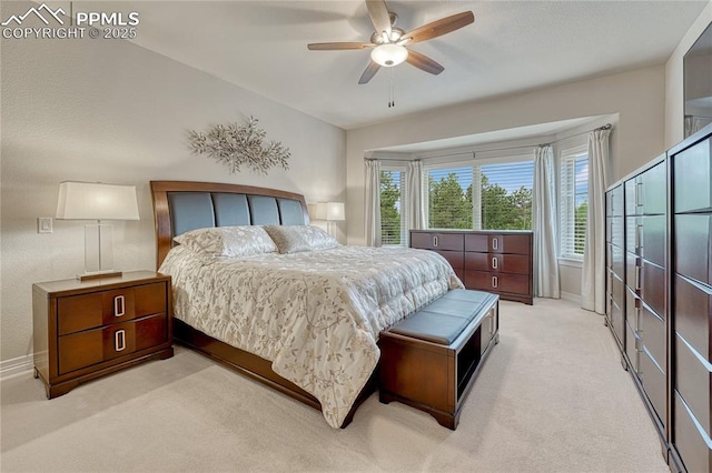 14745 Millhaven Pl, Colorado Springs, CO 80908 - bedroom with light colored carpet, baseboards, and ceiling fan