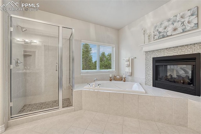 14745 Millhaven Pl, Colorado Springs, CO 80908 - bathroom with a bath, tile patterned floors, a stall shower, and a fireplace