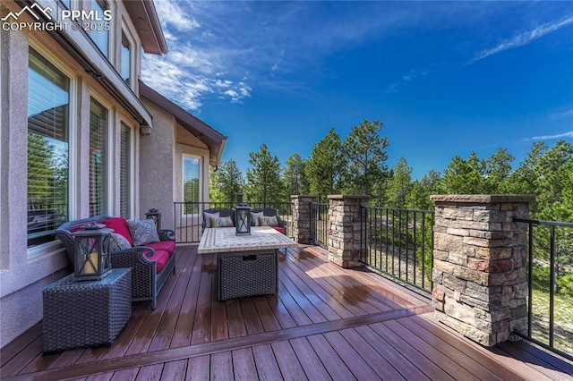 14745 Millhaven Pl, Colorado Springs, CO 80908 - wooden terrace with an outdoor hangout area
