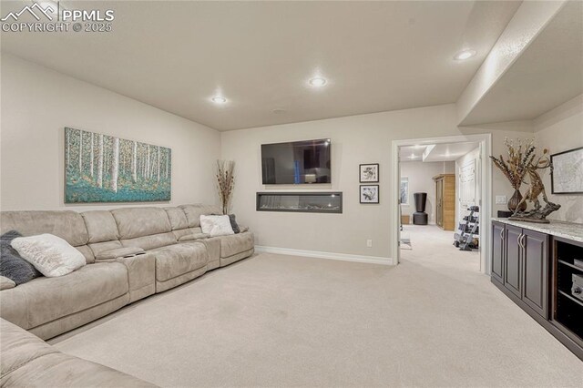 14745 Millhaven Pl, Colorado Springs, CO 80908 - living room with light carpet, recessed lighting, and baseboards