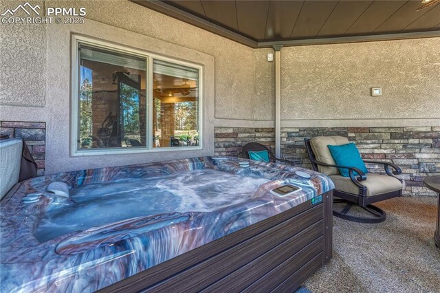 14745 Millhaven Pl, Colorado Springs, CO 80908 - exterior view of a jacuzzi and stone siding