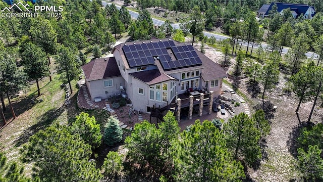 14745 Millhaven Pl, Colorado Springs, CO 80908 - aerial view of property and surrounding area with a tree filled landscape