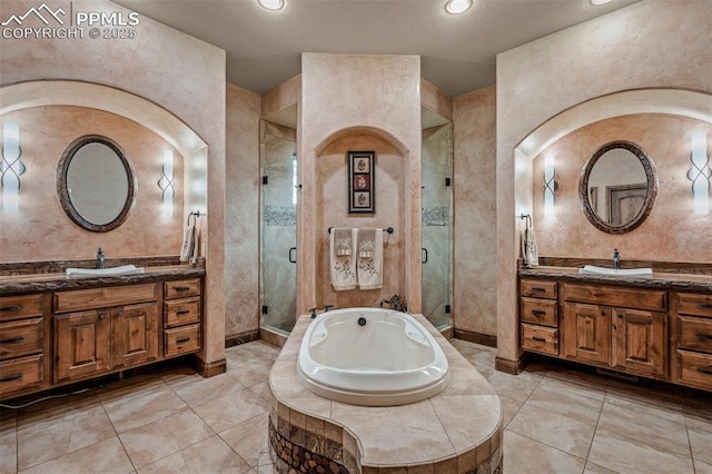 8610 Wildridge Rd, Colorado Springs, CO 80908 - full bath with a shower stall, a bath, two vanities, tile patterned flooring, and recessed lighting