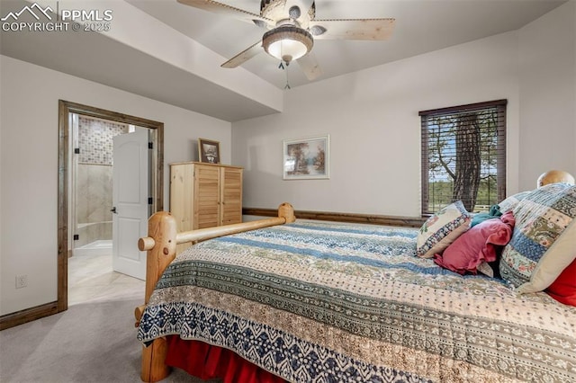 8610 Wildridge Rd, Colorado Springs, CO 80908 - carpeted bedroom featuring connected bathroom, baseboards, and a ceiling fan