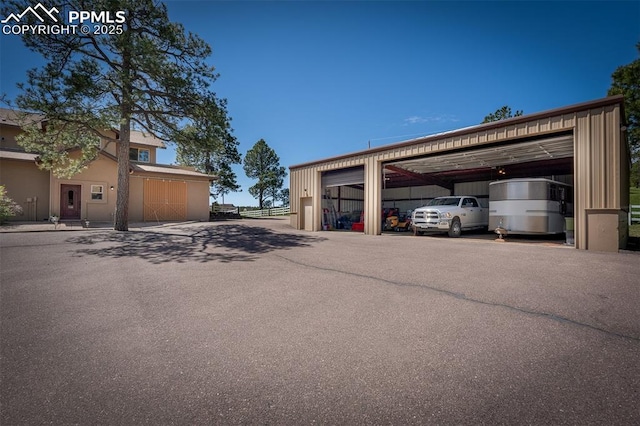 8610 Wildridge Rd, Colorado Springs, CO 80908 - view of vehicle parking featuring a detached garage