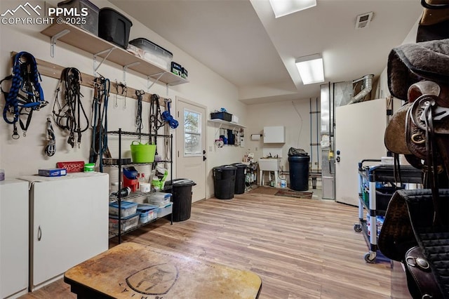 8610 Wildridge Rd, Colorado Springs, CO 80908 - basement with light wood-type flooring and a sink