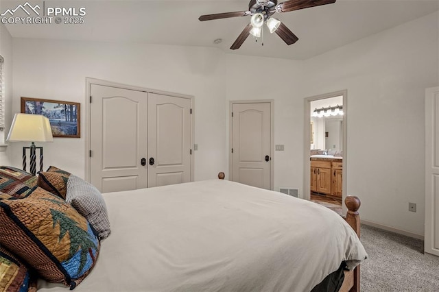 8610 Wildridge Rd, Colorado Springs, CO 80908 - bedroom with lofted ceiling, light carpet, baseboards, a ceiling fan, and ensuite bathroom