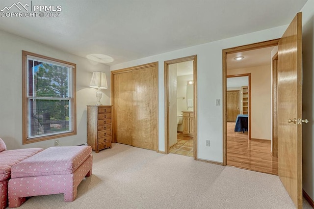 17580 Chipped Arrow Way, Monument, CO 80132 - bedroom featuring carpet, ensuite bathroom, and baseboards