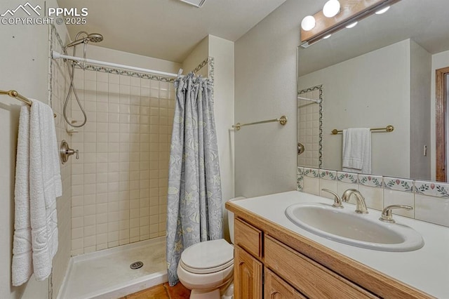 17580 Chipped Arrow Way, Monument, CO 80132 - bathroom featuring toilet, vanity, and a tile shower