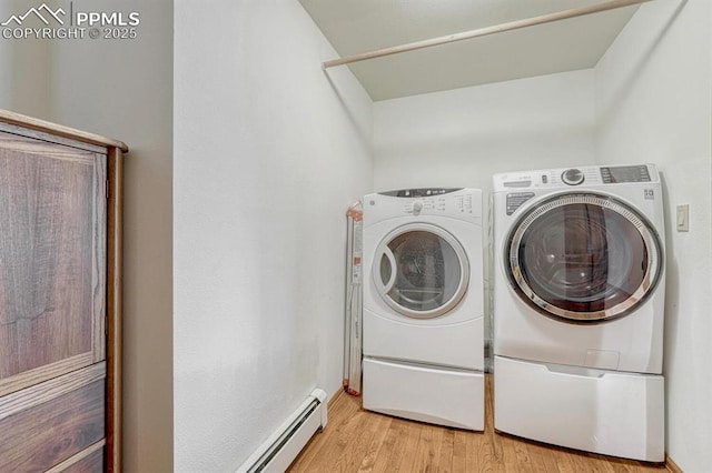 17580 Chipped Arrow Way, Monument, CO 80132 - laundry area with washer and dryer, light wood-style floors, and a baseboard heating unit