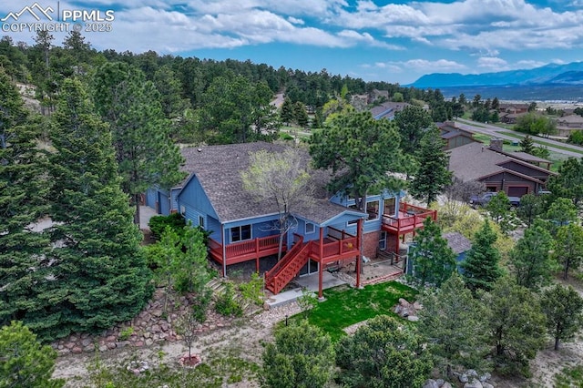 17580 Chipped Arrow Way, Monument, CO 80132 - aerial view of property and surrounding area featuring a mountainous background