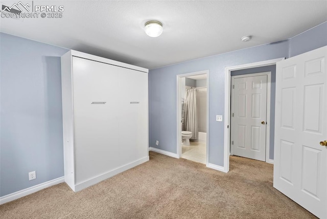 3730 Penny Pt Unit G, Colorado Springs, CO 80906 - unfurnished bedroom with carpet floors, baseboards, and ensuite bath