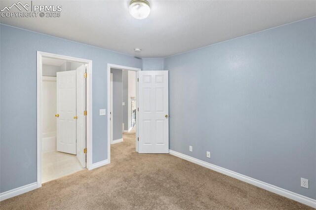 3730 Penny Pt Unit G, Colorado Springs, CO 80906 - unfurnished bedroom featuring carpet floors and baseboards