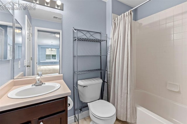 3730 Penny Pt Unit G, Colorado Springs, CO 80906 - bathroom featuring vanity, toilet, and shower / tub combo with curtain