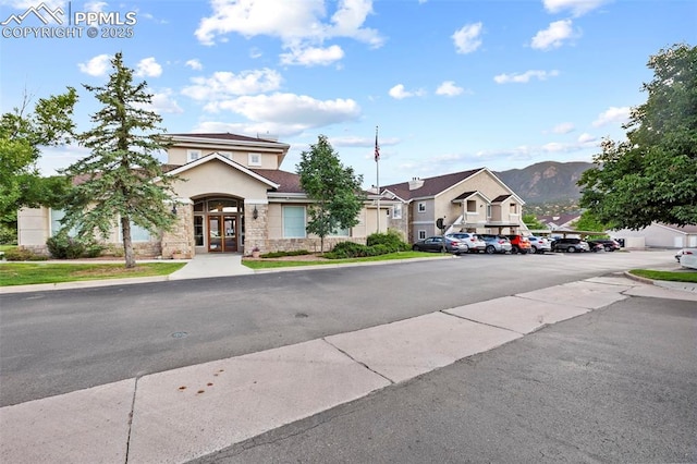 3730 Penny Pt Unit G, Colorado Springs, CO 80906 - view of asphalt road with sidewalks and a mountain view