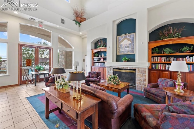 3730 Penny Pt Unit G, Colorado Springs, CO 80906 - living room featuring a high ceiling, light tile patterned floors, a fireplace, recessed lighting, and built in shelves