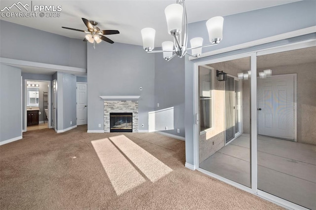 3730 Penny Pt Unit G, Colorado Springs, CO 80906 - unfurnished living room with a chandelier, carpet flooring, ceiling fan, baseboards, and vaulted ceiling