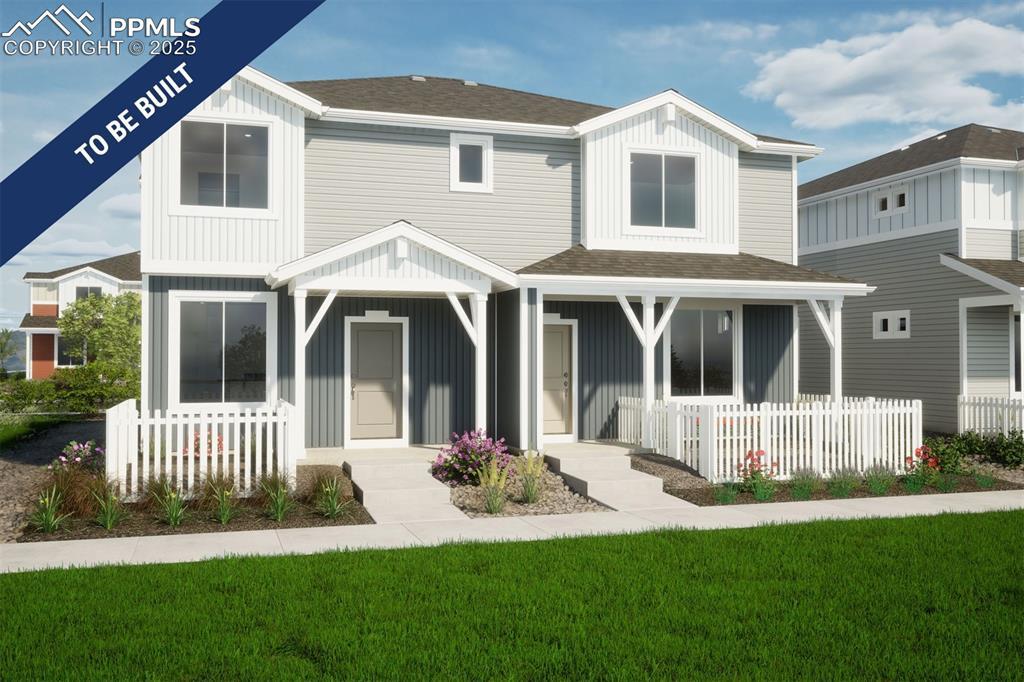 5843 Uptop Pt, Colorado Springs, CO 80927 - rear view of property featuring board and batten siding, a porch, and roof with shingles