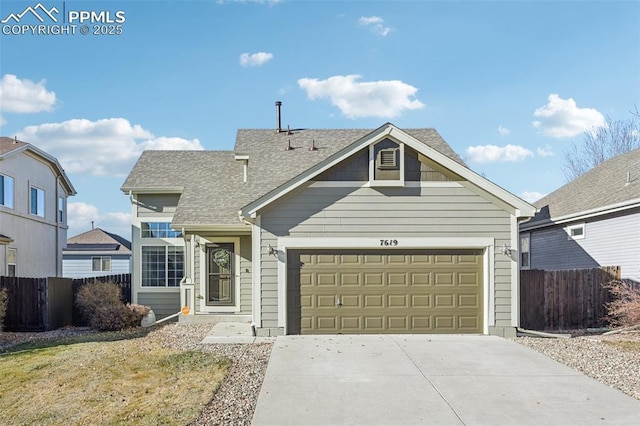 7619 Steward Ln, Colorado Springs, CO 80922 - view of front of home with driveway, a garage, and roof with shingles