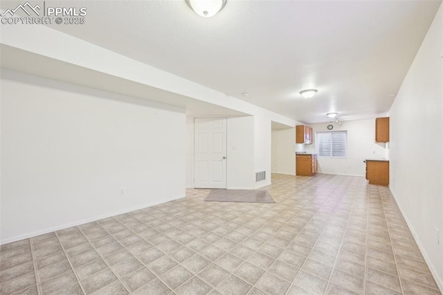 7619 Steward Ln, Colorado Springs, CO 80922 - unfurnished living room with baseboards