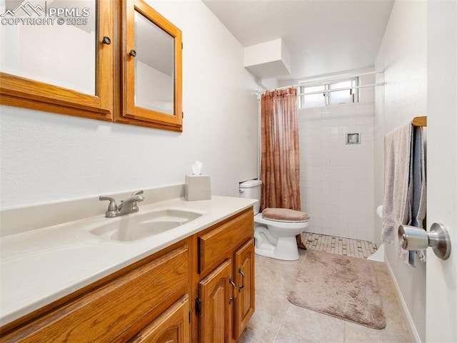 63 Radcliff Ln, Pueblo, CO 81005 - bathroom with vanity, toilet, tiled shower, and tile patterned flooring