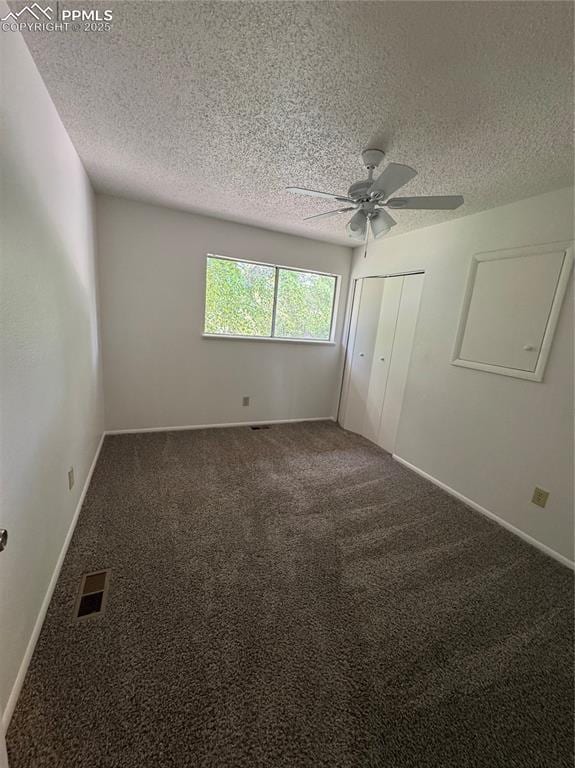 1402 Yosemite Dr, Colorado Springs, CO 80910 - unfurnished bedroom featuring a textured ceiling, carpet, a closet, a ceiling fan, and baseboards