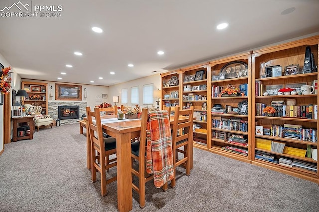 435 W Woodmen Rd, Colorado Springs, CO 80919 - carpeted dining area featuring recessed lighting and a stone fireplace