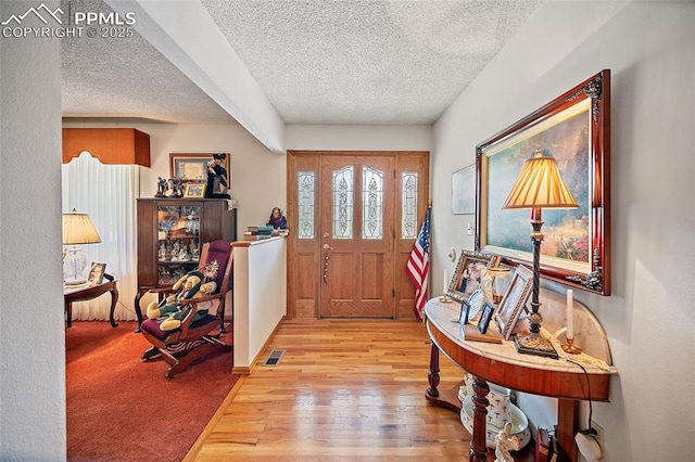 435 W Woodmen Rd, Colorado Springs, CO 80919 - entrance foyer featuring a textured ceiling and wood-type flooring