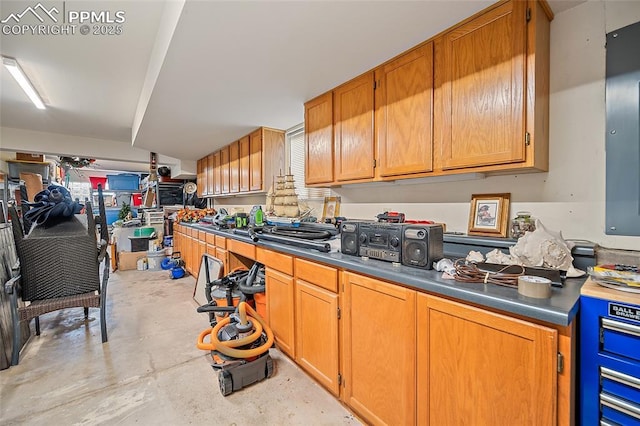 435 W Woodmen Rd, Colorado Springs, CO 80919 - kitchen featuring unfinished concrete floors and brown cabinets
