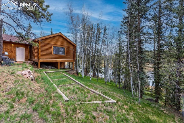 1369 Spring Valley Dr, Divide, CO 80814 - back of house with log exterior