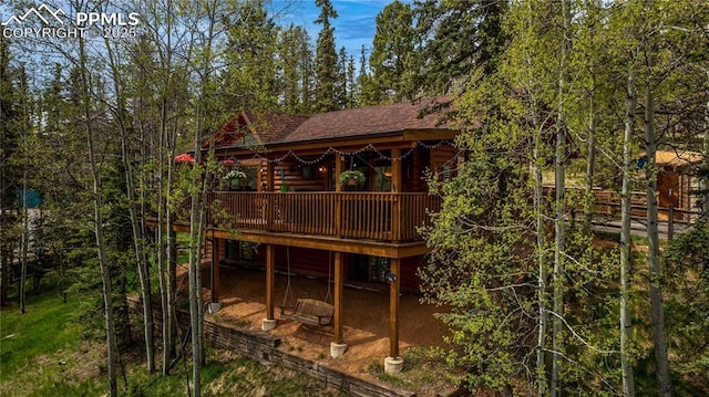 1369 Spring Valley Dr, Divide, CO 80814 - back of house with roof with shingles and a deck