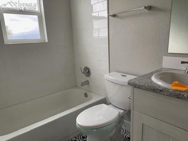 10910 Double D Rd, Fountain, CO 80817 - full bath with a textured wall, vanity, toilet, and bathtub / shower combination