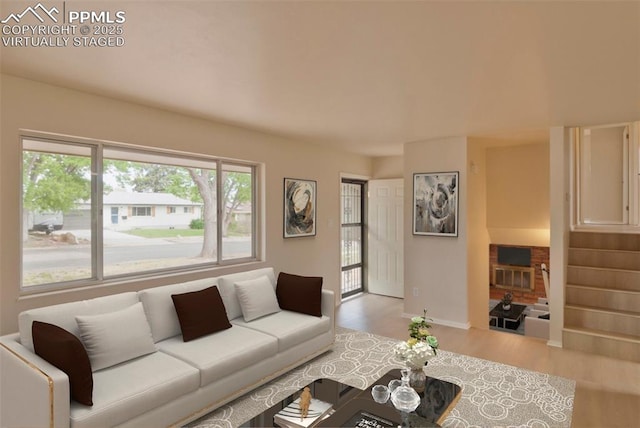 1934 Berkshire Ln, Colorado Springs, CO 80909 - living area with wood finished floors, stairway, and baseboards