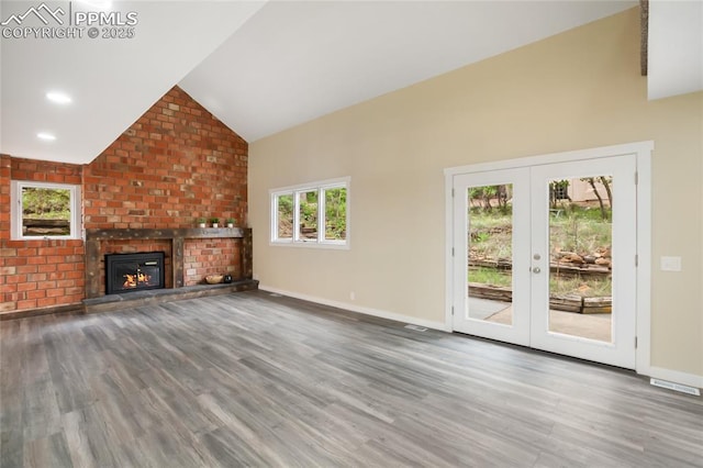 595 Wintery Cir, Colorado Springs, CO 80919 - unfurnished living room with wood finished floors, french doors, high vaulted ceiling, and baseboards