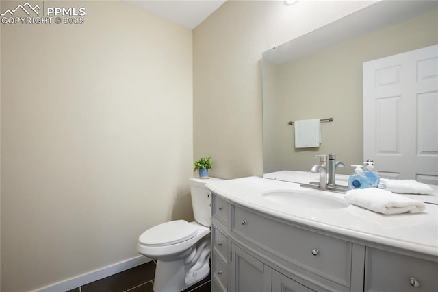 595 Wintery Cir, Colorado Springs, CO 80919 - half bath with vanity, toilet, and baseboards
