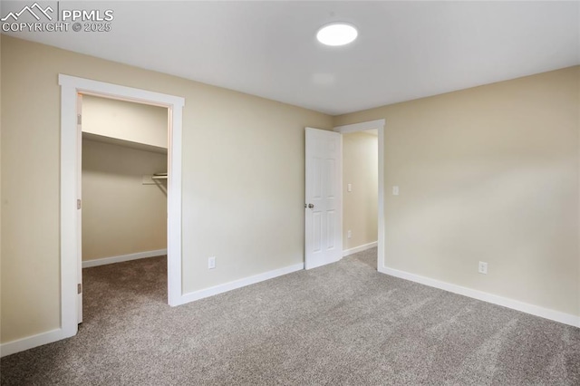 595 Wintery Cir, Colorado Springs, CO 80919 - unfurnished bedroom featuring carpet, baseboards, and a spacious closet