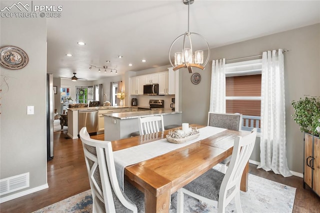 7833 Bengali Ln, Colorado Springs, CO 80923 - dining area featuring recessed lighting, wood finished floors, baseboards, a chandelier, and a ceiling fan